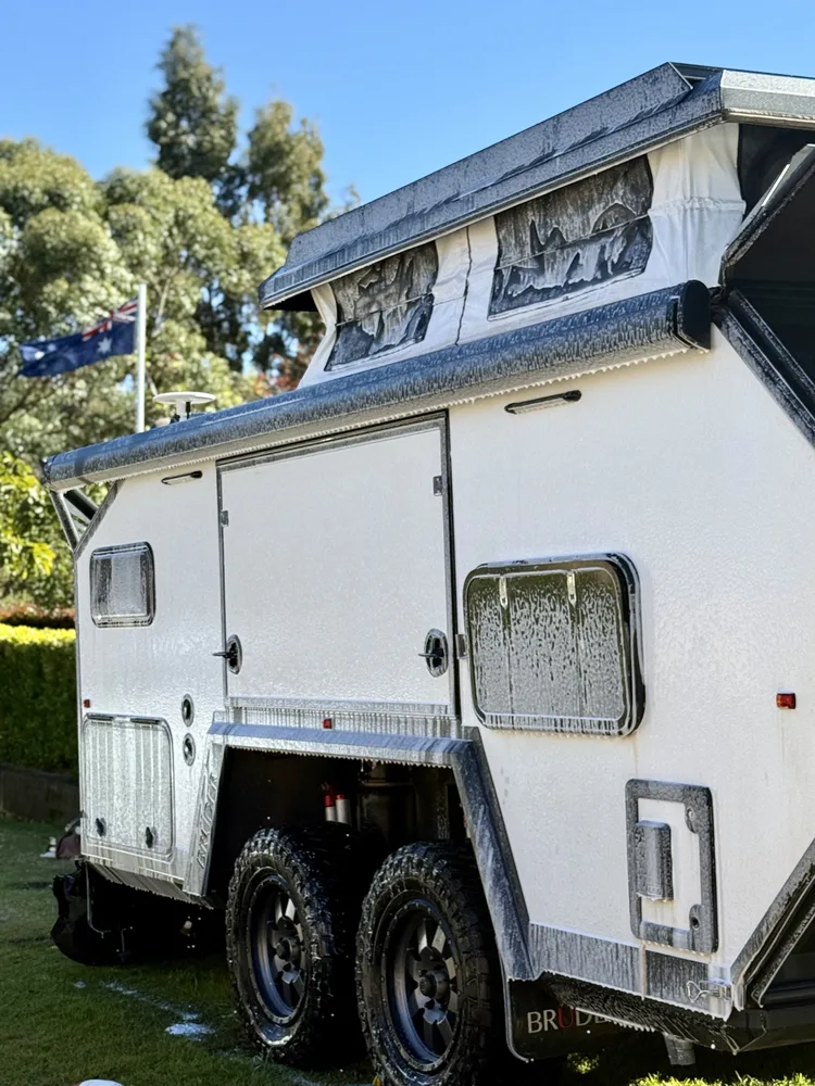 Camper trailer exterior mid-wash, foam covering panels, Perth